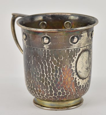 Lot 1150 - A George V hallmarked silver mug with hammered...