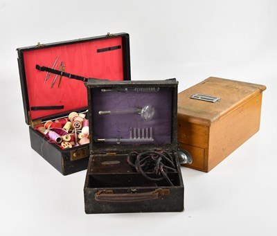 Lot 2212 - A vintage cash register, a case containing...