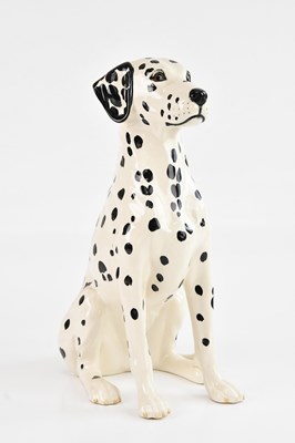 Lot 1231 - ROYAL DOULTON; a fireside model of a seated...