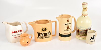 Lot 1331 - A small group of whisky jugs to include Bell's,...