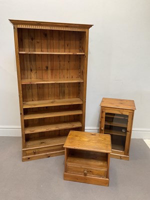 Lot 2131 - A modern pine open fronted bookcase, with...