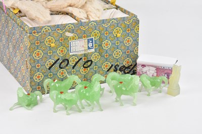 Lot 1044 - Eight green hardstone models of horses, each...