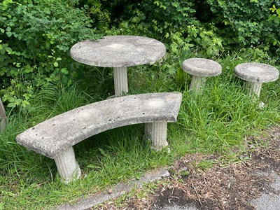 Lot 2141 - A reconstituted stone garden table, with...