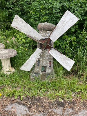 Lot 2142 - A reconstituted stone and metal garden...