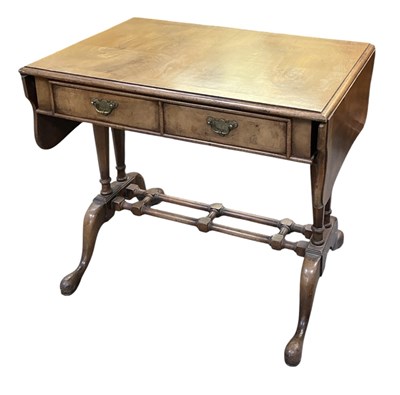 Lot 110 - A reproduction walnut drop-leaf two drawer...