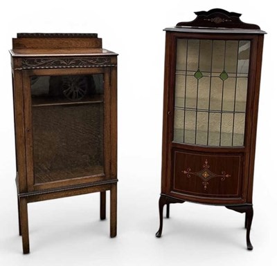 Lot 69 - An early 20th century carved oak display...
