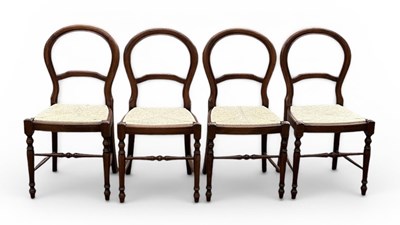 Lot 112 - A set of four early 20th century rush seated...