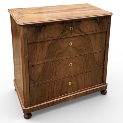 Lot 108 - An early 20th century walnut chest of four...
