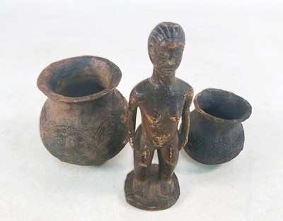 Lot 13 - An African hardwood figure of a woman, height...
