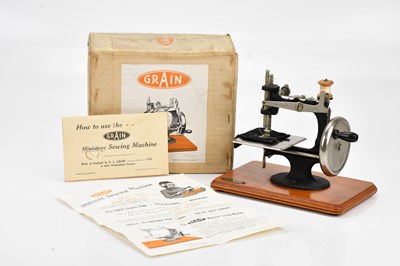 Lot 501 - GRAIN; a miniature childs sewing machine, with...