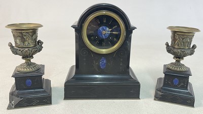 Lot 237 - A French Neoclassical black slate mantel clock...