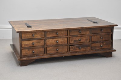 Lot 35 - A modern stained hardwood coffee table, with...