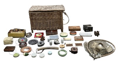 Lot 494 - A hand woven wicker basket containing a...
