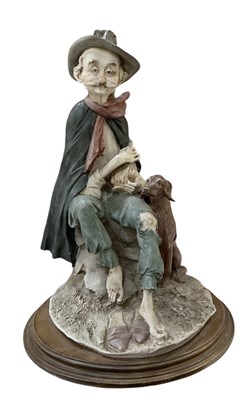 Lot 692 - CAPODIMONTE; a porcelain figure, 'Tramp on a...