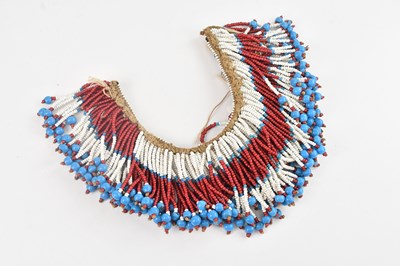 Lot 1135 - A 19th century Zulu beaded collar, length 29cm.