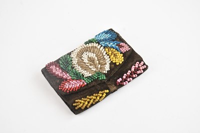 Lot 1160 - An Iroquois small beaded purse, 9 x 6cm.