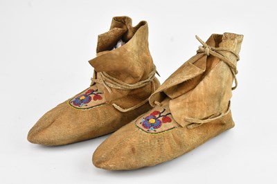 Lot 1120 - A pair of Native American moccasins, with...