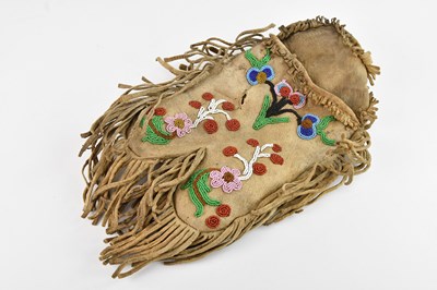 Lot 1132 - A Native American animal hide bag, decorated...