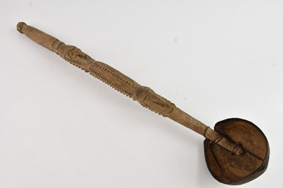 Lot 1151 - A 19th century Sepik River carved wooden ladle,...