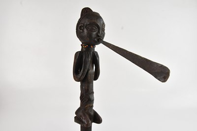 Lot 1140 - A possibly Luba figural African axe, length 44cm.