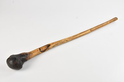 Lot 1178 - A Native American war club with painted top,...