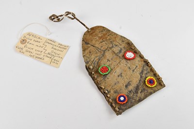 Lot 1143 - An African bushman's rawhide pouch, with...