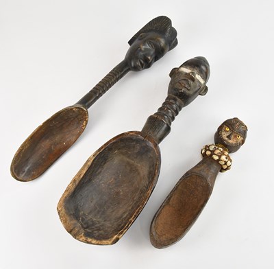 Lot 1123 - Two carved wooden Dan spoons, each with carved...