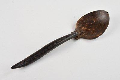 Lot 1189 - A Sri Lankan coconut shell spoon, 25cm.