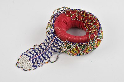 Lot 1119 - A Native American beaded Indhoni pot stand,...