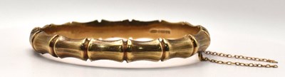 Lot 639 - A 9ct gold hinged bangle, 10.4g