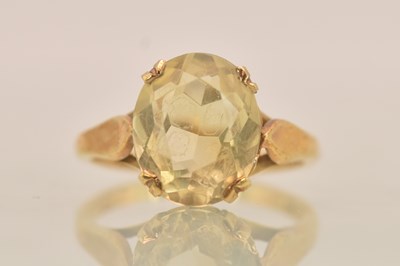 Lot 1320 - A 9ct yellow gold citrine set dress ring, the...