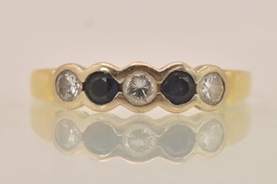 Lot 1248 - An 18ct yellow gold sapphire and diamond set...