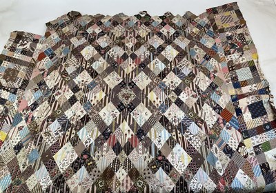 Lot 137 - A Victorian patchwork quilt composed of...