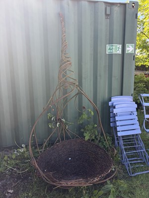 Lot 2144 - A wrought iron hanging garden seat, of organic...