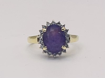 Lot 655 - A 9ct yellow gold diamond and amethyst cluster...