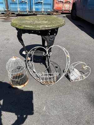 Lot 2161 - A cast iron garden table with wood top, height...