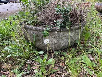 Lot 2162 - A reconstituted stone circular garden planter,...