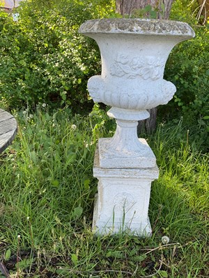 Lot 2150 - A reconstituted stone garden urn on stand,...