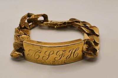 Lot 634 - A 9ct yellow gold flat Cuban link identity...