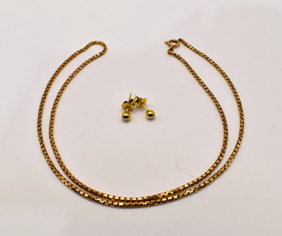 Lot 642 - A 9ct yellow gold tubular link necklace (cut),...