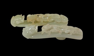 Lot 26 - A Chinese white jade figural belt buckle...