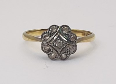 Lot 658 - An 18ct yellow gold white stone set flower...