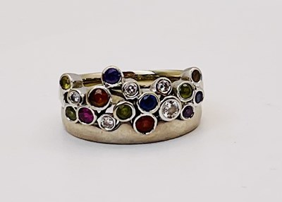Lot 636 - An 18ct white gold multigem set tutti fruiti...
