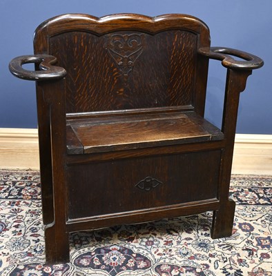 Lot 2904 - A 1930s oak hall seat, with umbrella support,...