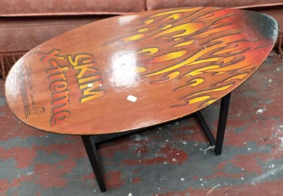 Lot 9 - A small novelty coffee table, the top in the...