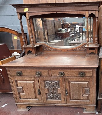 Lot 21 - An early 20th century oak mirror back dresser,...