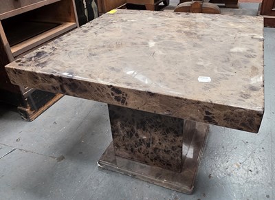 Lot 22 - A polished stone square section coffee table,...