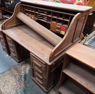 Lot 26 - An early 20th century oak roll-top clerk's...