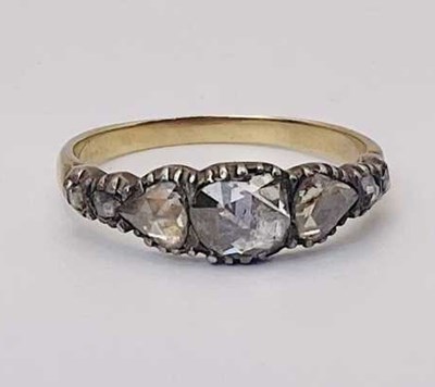 Lot 654 - A 19th century seven stone diamond ring, set...
