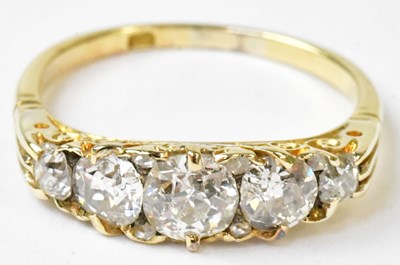 Lot 898 - An 18ct yellow gold ring set with five...
